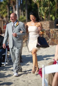 Stunning Italian mother of the groom, rocking her stiletto heels in the sand - how does she do that!?
