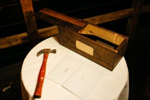 Just enough room for a bottle of wine, opener, two letters. And I love the well-used old hammer - what a great touch! Photo by Anika London.