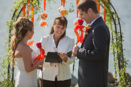 DO: Beautiful vibrant colors add whimsy and fun to this wedding ceremony. DON'T: It was a windy day, and the ribbons kept wrapping around me and going in my face, the baubles flapping in the breeze