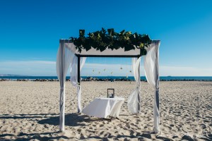 The iconic Coronado beach sets the stage for this simple huppah. Photo by Derek Chad