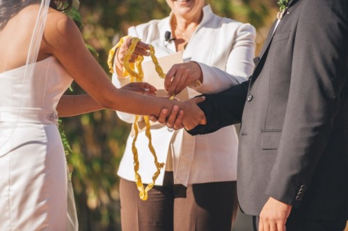 Expressing vows with the beautiful handbinding ritual. Photo by Mink Photography