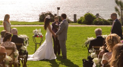 These wine boxes designate the space and frame the breathtaking view of cliffside ceremony at Seagrove Park; serve as a table; and also fit the theme of this wine-lover couple. Photo by StudioZ