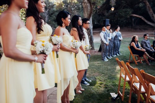 Wedding attendants create a beautiful human backdrop outside the circle. Photo by Melissa Abiador