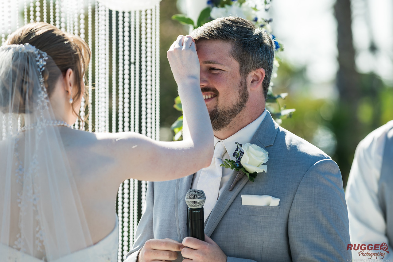 bride wiping groom brow
